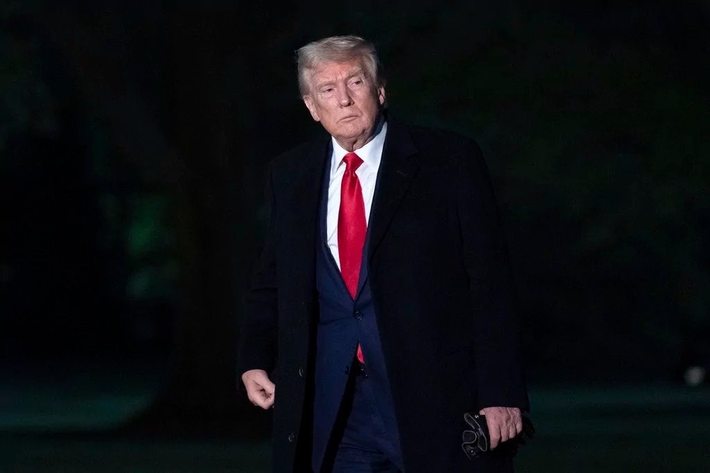 President Donald Trump walks on the South Lawn of the White House in Washington, Sunday, April 13, 2025.