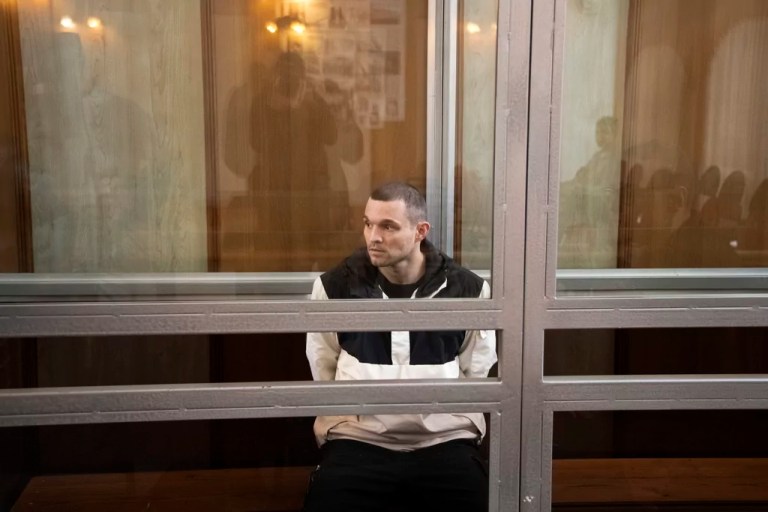 U.S. Army Staff Sgt. Gordon Black sits in a glass cage in a courtroom in Vladivostok, Russia, Thursday, June 6, 2024.