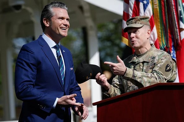 U.S. Secretary of Defense Pete Hegseth (L) jokes with Commandant of the Army War College Major General David Hill as he delivers remarks to students, faculty and staff at the U.S. Army War college on April 23, 2025 in Carlisle, Pennsylvania. The visit comes amid controversy following reports that Hegseth discussed sensitive military communications in an unsecured Signal chat for the second time with his wife, brother and others. 