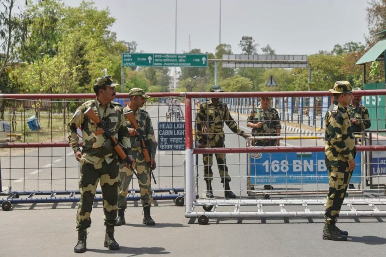 Indian Border Security Force soldiers stand guard at the barricade on the road leading to the Attari-Wagah border on India's side, near Amritsar, Thursday, April 24, 2025.