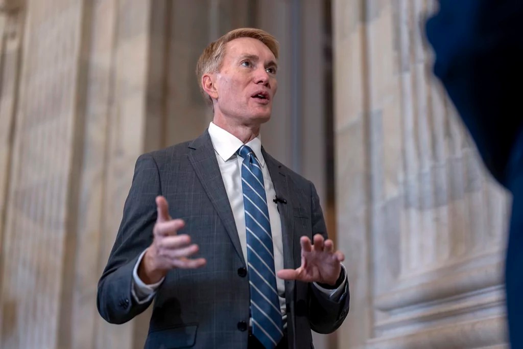Sen. James Lankford, R-Okla., the lead GOP negotiator on the Senate border and foreign aid package, does a TV news interview on Capitol Hill in Washington, Monday, Feb. 5, 2024.