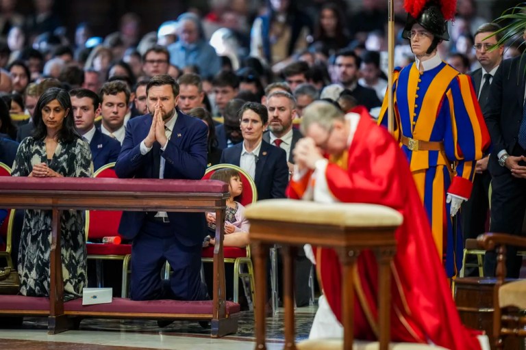 U.S. Vice President JD Vance, and his wife Usha Vance, left, with their daughter Mirabel, attend a Good Friday service led by Cardinal Claudio Gugerotti, right, inside St. Peter's Basilica at the Vatican, Friday, April 18, 2025.