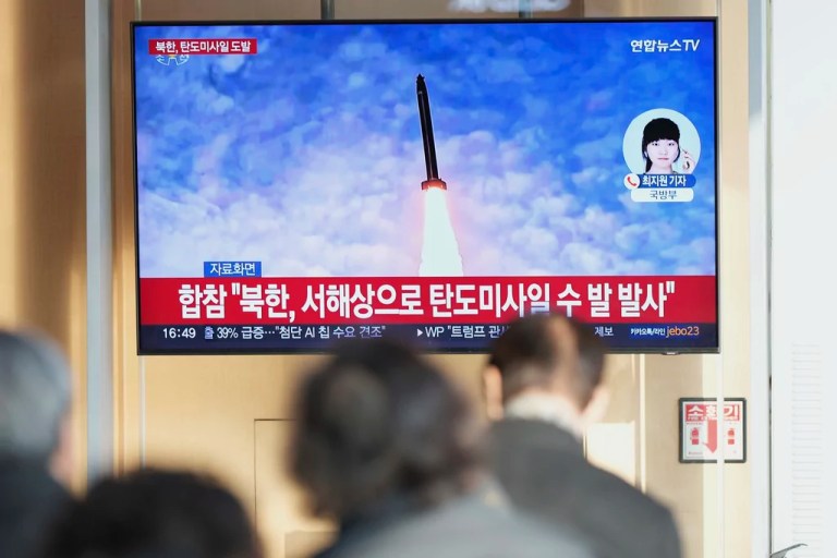 A TV screen shows a report of North Korea's missile launch with a file image during a news program at the Seoul Railway Station in Seoul, South Korea, Monday, March 10, 2025.