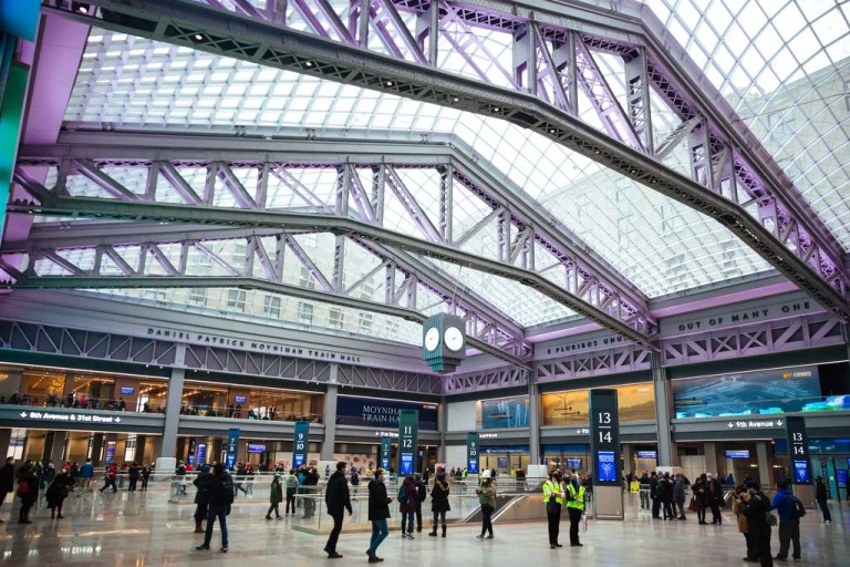Passengers mill about on opening day at the newly-completed Moynihan Train Hall Friday, Jan. 1, 2021, in New York.