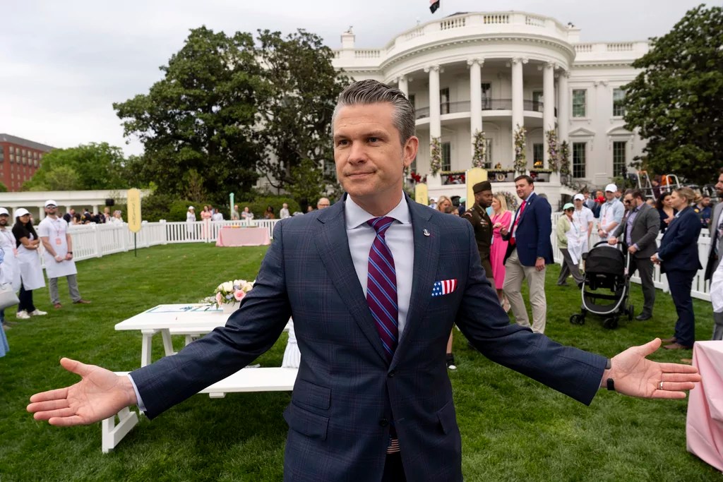 Defense Secretary Pete Hegseth speaks with reporters on the South Lawn of the White House before President Donald Trump and first lady Melania Trump participate in the White House Easter Egg Roll Monday, April 21, 2025, in Washington.