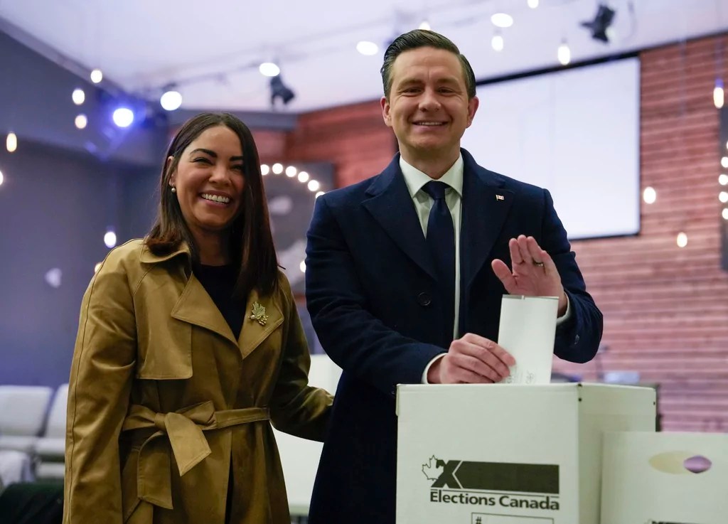 Conservative Leader Pierre Poilievre, right, and his wife Anaida Poilievre cast their votes in the federal election in Ottawa, Canada, Monday, April 28, 2025 in Ottawa.