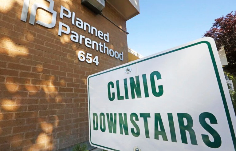 A sign is displayed at Planned Parenthood of Utah Wednesday, Aug. 21, 2019, in Salt Lake City. About 39,000 people received treatment from Planned Parenthood of Utah in 2018 under a federal family planning program called Title X. The organization this week announced it is pulling out of the program rather than abide by a new Trump administration rule prohibiting clinics from referring women for abortions.