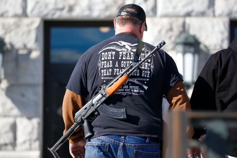 A man carries his weapon during a second amendment gun rally at Utah State Capitol Saturday, Feb. 8, 2020, in Salt Lake City.