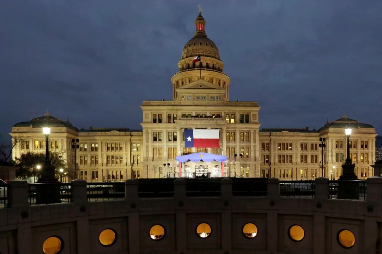 In this Jan. 14, 2019 file photo, a large Texas flag hangs from the Texas State Capitol in Austin, Texas. A federal judge has struck down a Texas law requiring age verification and health warnings to view pornographic websites and blocked the state attorney general's office from enforcing it. U.S. District Judge David Ezra on Thursday, Aug. 31, 2023 agreed with claims that the bill signed into law by Gov. Greg Abbott in June violates free speech rights, is overbroad and vague.