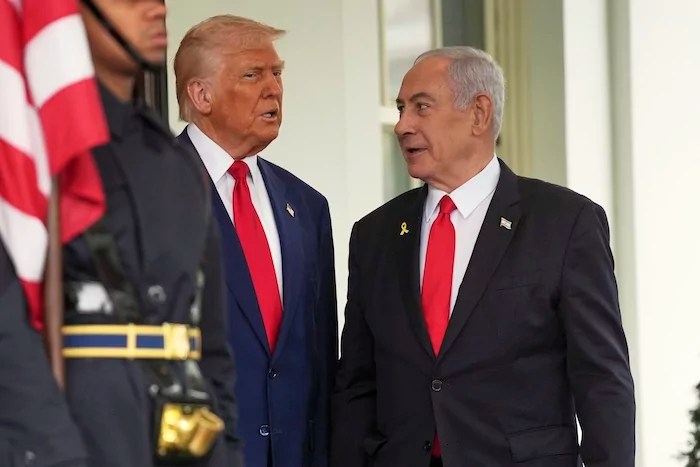 President Donald Trump, left, greets Israel's Prime Minister Benjamin Netanyahu at the White House, Monday, April 7, 2025, in Washington.