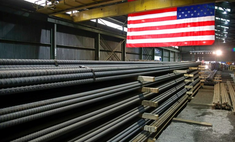 In this May 9, 2019, file photo, steel rods produced at the Gerdau Ameristeel mill in Saint Paul, Minnesota, await shipment. In a deal announced Tuesday, March 22, 2022, the United States has agreed to lift tariffs on British steel and aluminum, mending a rift between allies that dates back to the Trump administration.