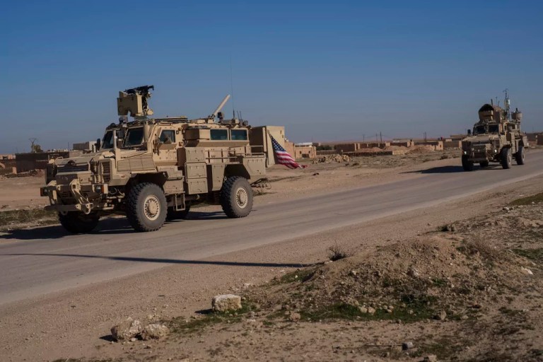 A U.S. military convoy drives along a road in northeastern Syria's Hasakeh province, Thursday, Jan. 30, 2025.