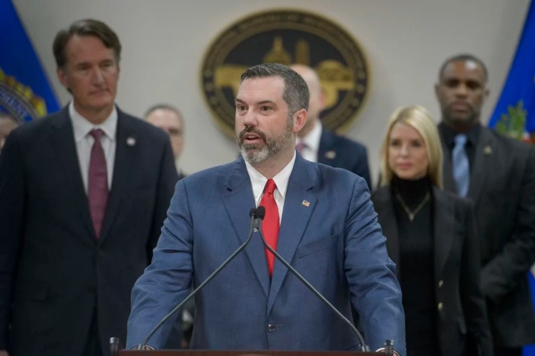 Erik Siebert, interim U.S. attorney for the eastern district of Virginia, speaks as Attorney General Pam Bondi, right, and Gov. Glenn Youngkin (R-VA), left, listen during a news conference about an MS-13 gang leader who was arrested in an operation by the Virginia Homeland Security Task Force, at the Manassas FBI Field Office, Thursday, March 27, 2025, in Manassas, Virginia.