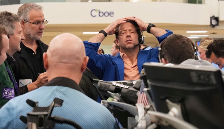 A trader reacts as other traders work on the options trading floor at the Cboe Global Markets in Chicago, Tuesday, April 8, 2025.