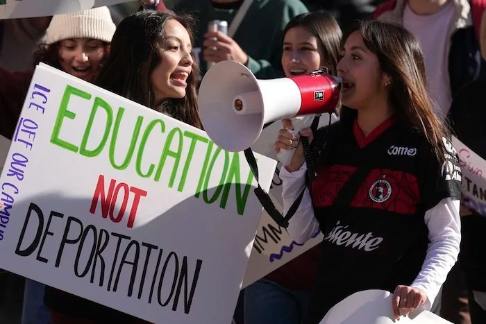 Students march at Arizona State University in protest of ASU's chapter of College Republicans United-led event encouraging students to report 