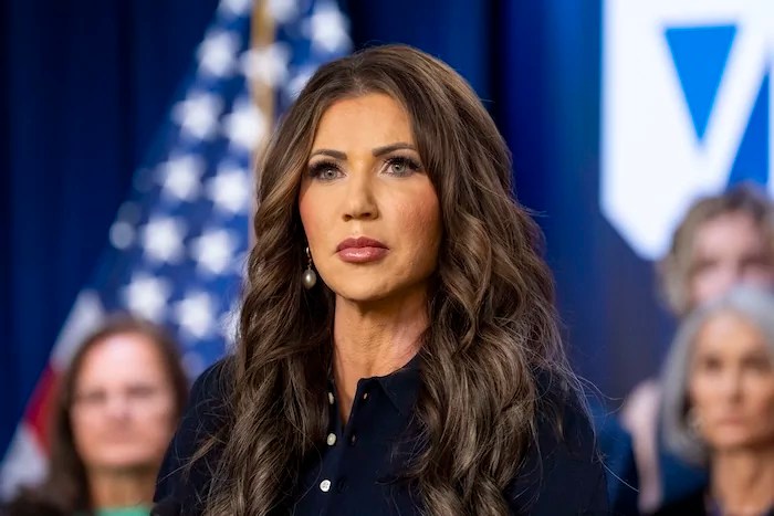 Homeland Security Secretary Kristi Noem speaks during a news conference to announce the relaunch of the Victims of Immigration Crime Engagement office with families of victims behind her, at the Immigration and Customs Enforcement headquarters, Wednesday, April 9, 2025, in Washington.