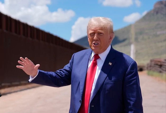 Republican presidential nominee former President Donald Trump talks as Paul Perez, president of the National Border Patrol Council, listens as he tours the southern border with Mexico, Thursday, Aug. 22, 2024, in Sierra Vista, Ariz. (AP Photo/Evan Vucci)