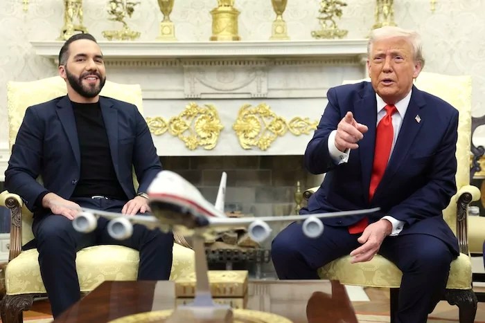 President Donald Trump speaks during a meeting with El Salvador's President Nayib Bukele, left, in the Oval Office of the White House in Washington, Monday, April 14, 2025. (Pool via AP)