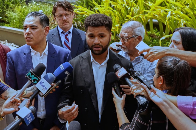 Rep. Maxwell Frost, D-Fla. speaks to the media about Kilmar Abrego Garcia, a Salvadoran citizen who was living in Maryland and deported to El Salvador by the Trump administration, accompanied by Rep. Robert Garcia, D-Calif., left, and attorney Chris Newman, second from left, at a hotel in San Salvador, El Salvador, Monday, April 21, 2025. (AP Photo/Salvador Melendez)