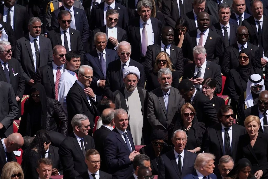 Former President Joe Biden, center, and President Donald Trump, lower right, and other dignitaries, attend the funeral of Pope Francis in St. Peter's Square at the Vatican.