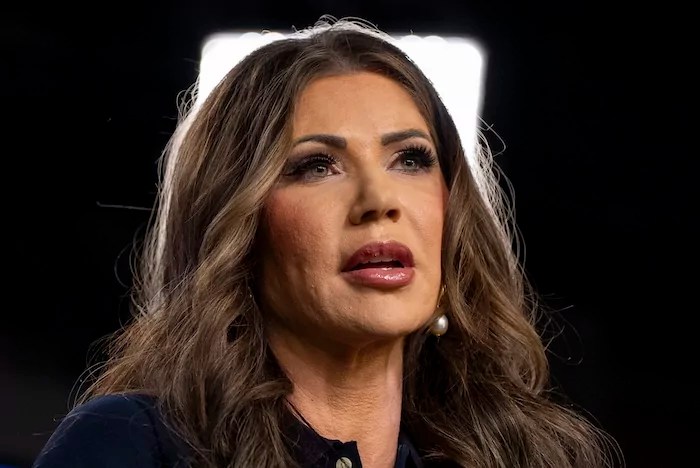 Homeland Security Secretary Kristi Noem speaks during a news conference to announce the re-launch of the VOICE office, Victims of Immigration Crime Engagement, with families of victims behind her, at the Immigration and Customs Enforcement headquarters, Wednesday, April 9, 2025, in Washington. (AP Photo/Alex Brandon)