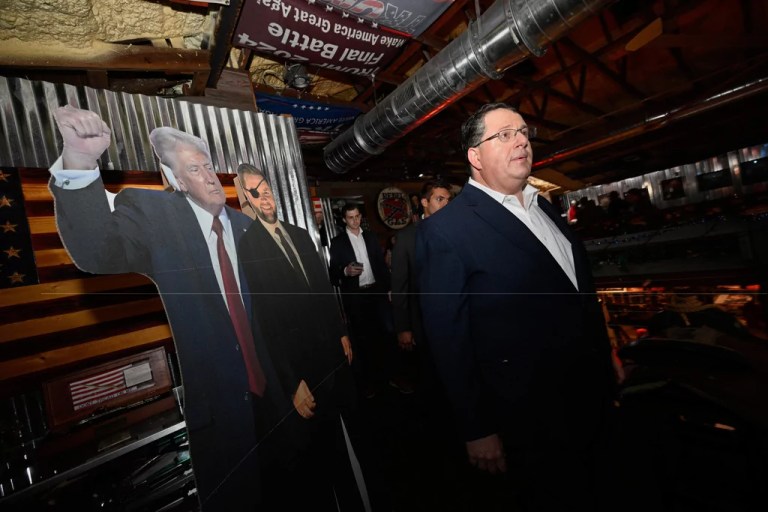 Republican Randy Fine walks past a cut-out of President Donald Trump after the special election for U.S. House District 6 was called in his favor, Tuesday, April 1, 2025 in Ormond Beach, Fla. (AP Photo/Phelan M. Ebenhack)
