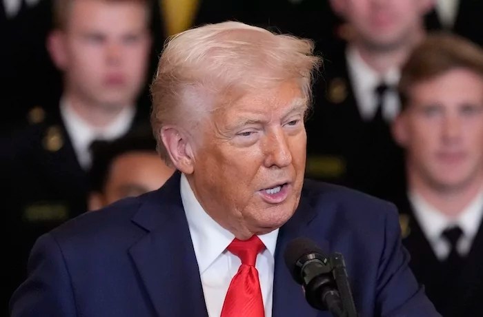 President Donald Trump speaks during the commander-in-chief trophy presentation to the Navy Midshipman football team in the East Room of the White House, Tuesday, April 15, 2025, in Washington.