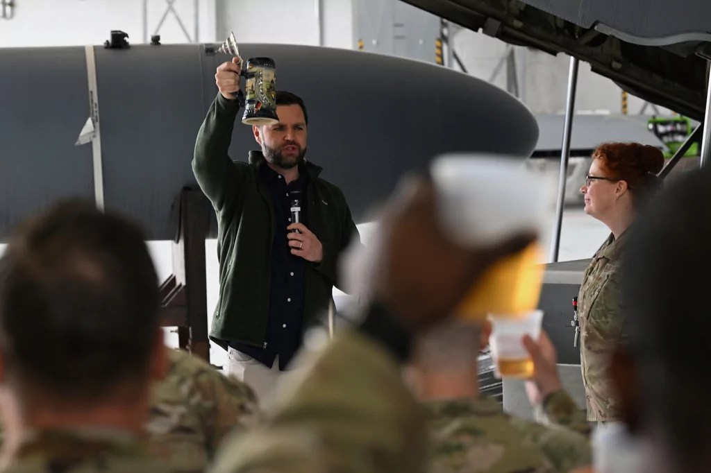 Vance serves up beer to US airmen in Germany and signs a kegerator