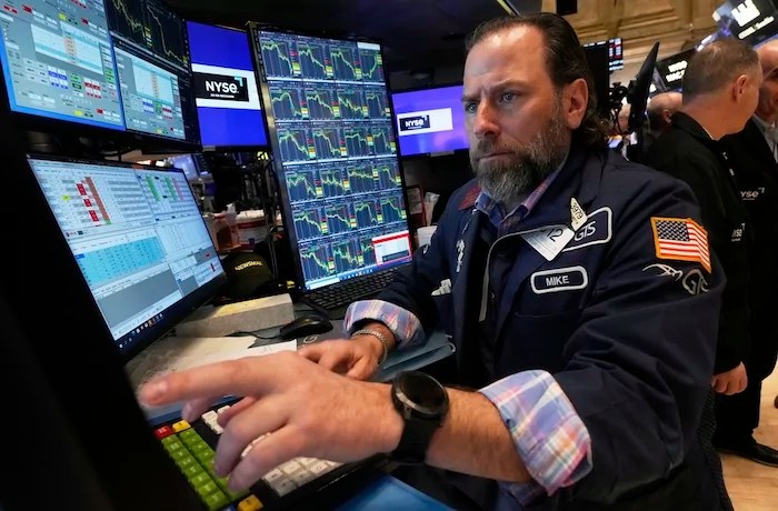 Specialist Michael Pistillo works on the floor of the New York Stock Exchange, Friday, April 4, 2025.