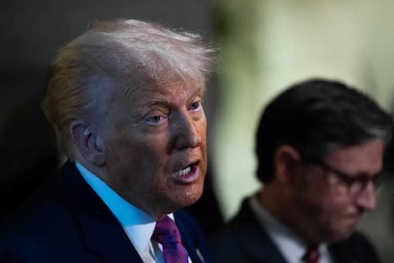 President Donald Trump talks with Speaker Mike Johnson (R-LA) during a visit at the Capitol to meet with the House Republican Conference on the reconciliation bill on Tuesday, May 20, 2025. (Graeme Jennings/Washington Examiner)