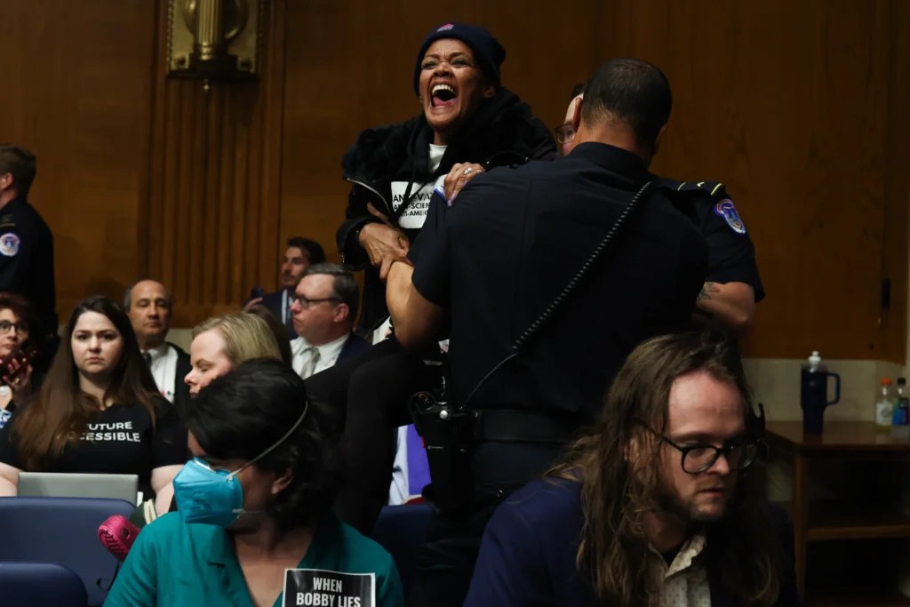 Protestors interrupt HHS Secretary Robert F. Kennedy Jr. testifying before the Senate Health, Education, Labor, and Pensions Committee on Wednesday, May 14, 2025 (Graeme Jennings, Washington Examiner).