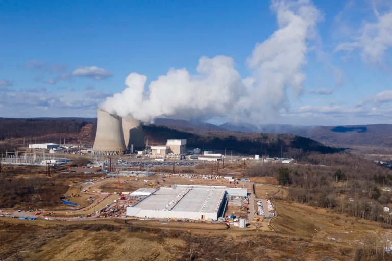 A data center owned by Amazon Web Services, front right, is under construction next to the Susquehanna nuclear power plant in Berwick, Pennsylvania, on Tuesday, Jan. 14, 2024.