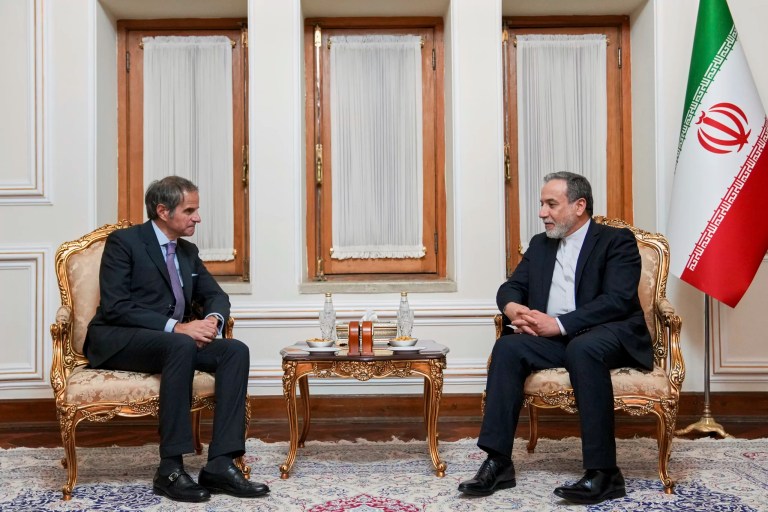 In this photo released by the Iranian Foreign Ministry, Foreign Minister Abbas Araghchi, right, speaks with International Atomic Energy Agency Director General Rafael Mariano Grossi during their meeting in Tehran, Iran, Wednesday, April 16, 2025.
