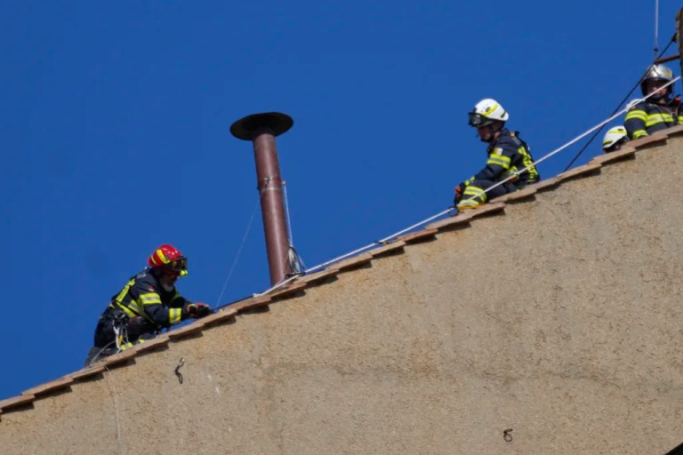 Sistine Chapel chimney installed by Vatican fire corps ahead of conclave
