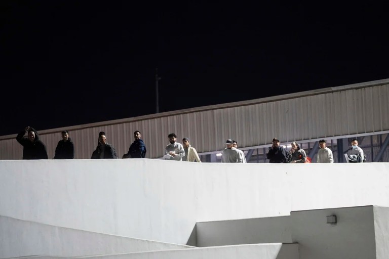 Migrants walk into Mexico after being deported from the United States at El Chaparral pedestrian border bridge in Tijuana, Mexico, Jan. 21, 2025.