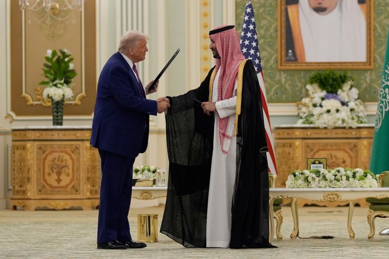 President Donald Trump and Saudi Crown Prince Mohammed bin Salman shake hands after exchanging documents during a signing ceremony at the Royal Palace in Riyadh, Saudi Arabia, Tuesday, May 13, 2025.