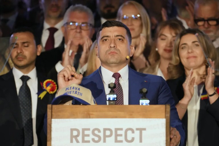Romanian Presidential candidate George Simion speaks to media after polls closed for the second round of the country's presidential election redo in Bucharest, Romania, Sunday, May 18, 2025.