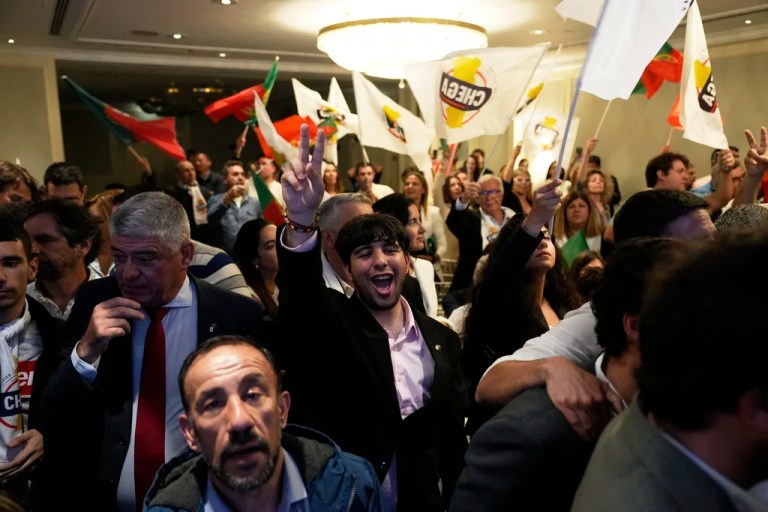 Supporters of the hard-right populist party Chega leader Andre Ventura react to preliminary results following Portugal's general election in Lisbon, Monday, May 19, 2025.