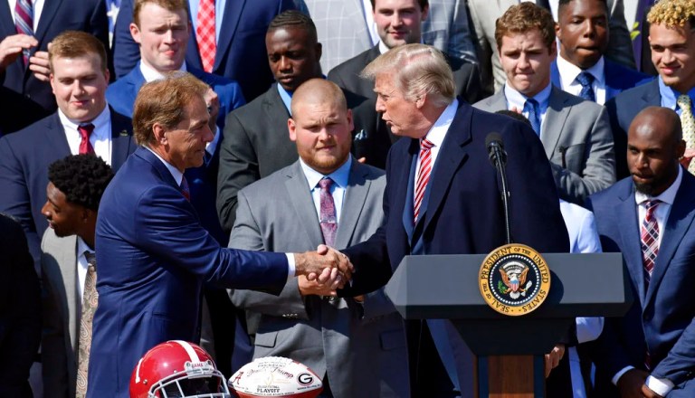 President Donald Trump shakes hands with Alabama head coach Nick Saban during an event for the 2017 NCAA National Champion University of Alabama football team on the South Lawn of the White House in Washington, Tuesday, April 10, 2018.