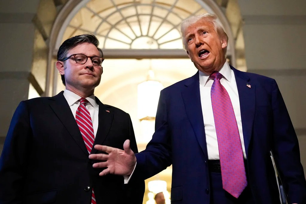 Speaker of the House Mike Johnson, R-La., and President Donald Trump arrive for a House Republican conference meeting, Tuesday, May 20, 2025, at the U.S. Capitol in Washington.