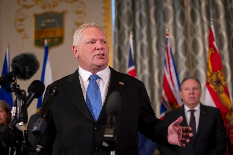 Premier of Ontario Doug Ford, accompanied by other Council of the Federation members, speaks to reporters at the Mayflower Hotel in Washington, Wednesday, Feb. 12, 2025.