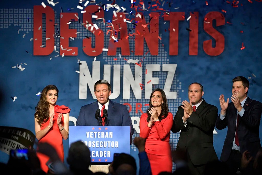 In this Nov. 6, 2018, photo, Florida Gov.-elect Ron DeSantis, second from left, thanks supporters with his wife, Casey, left, Lt. Gov.-elect Jeanette Nunez, center; her husband, Adrian Nunez, second from right, and Rep. Matt Gaetz, R-Fla., after being declared the winner of the Florida gubernatorial race at an election party in Orlando, Fla. 