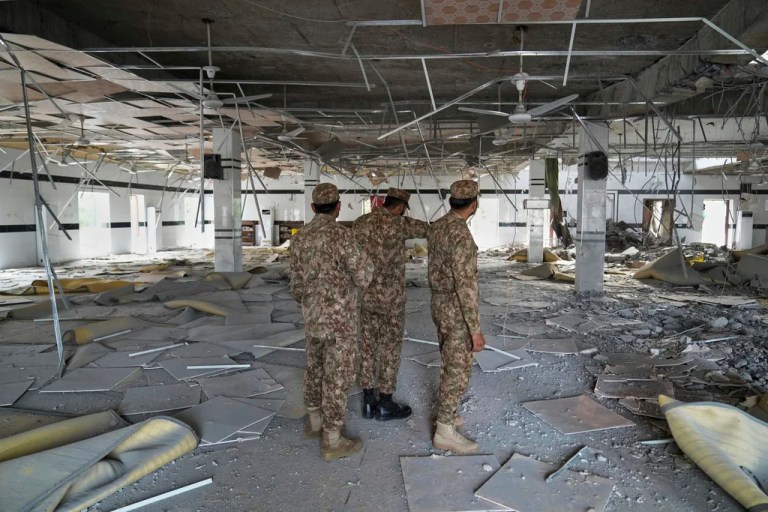 Army soldiers examine the rubble of a mosque building damaged by an Indian missile attack, in Muridke, a town in Pakistan's Punjab province, Wednesday, May 7, 2025.