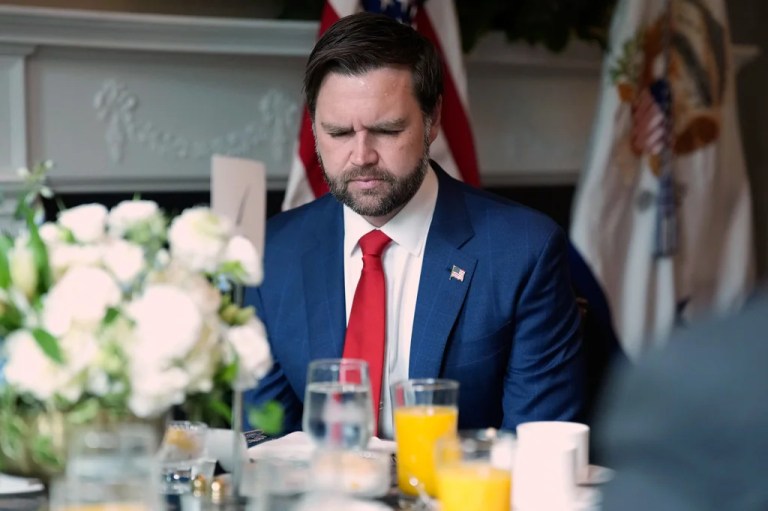 Vice President JD Vance bows his head in prayer during a National Police Week breakfast at the Vice President's residence, Wednesday, May 14, 2025 in Washington.