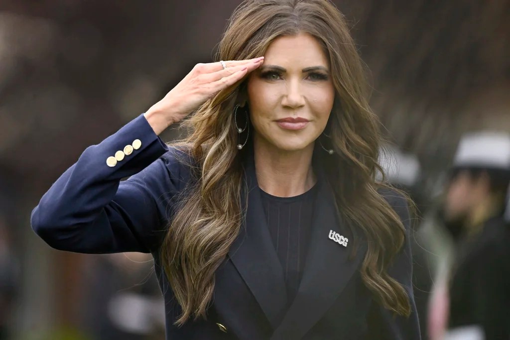 Homeland Security Secretary Kristi Noem salutes as she arrives at the commencement for the United States Coast Guard Academy, Wednesday, May 21, 2025 in New London, Conn.