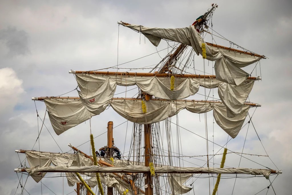 Crew members work on the mast of the Cuauhtémoc, a masted Mexican Navy training ship, at Pier 35 after it collided with the Brooklyn Bridge, Sunday, May 18, 2025, in New York