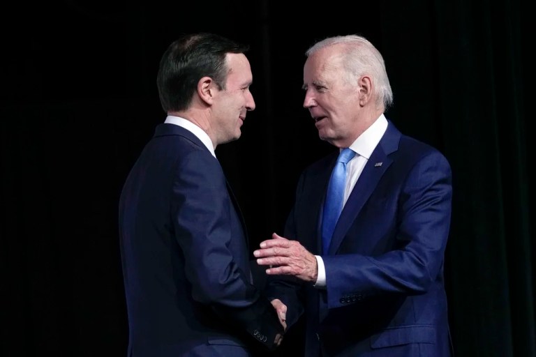 President Joe Biden shakes hands with Sen. Chris Murphy, D-Conn., after he was introduced to speak at the National Safer Communities Summit at the University of Hartford in West Hartford, Conn., Friday, June 16, 2023. The summit is attended by gun safety advocates, families impacted by gun violence and local leaders.