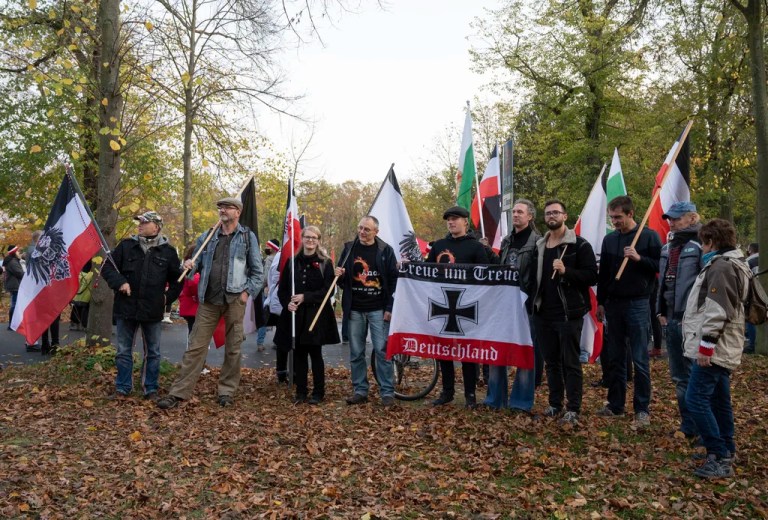 Participants of a demonstration of Reich citizens carry black and white and other flags in Potsdam, Germany, Nov. 14, 2020.