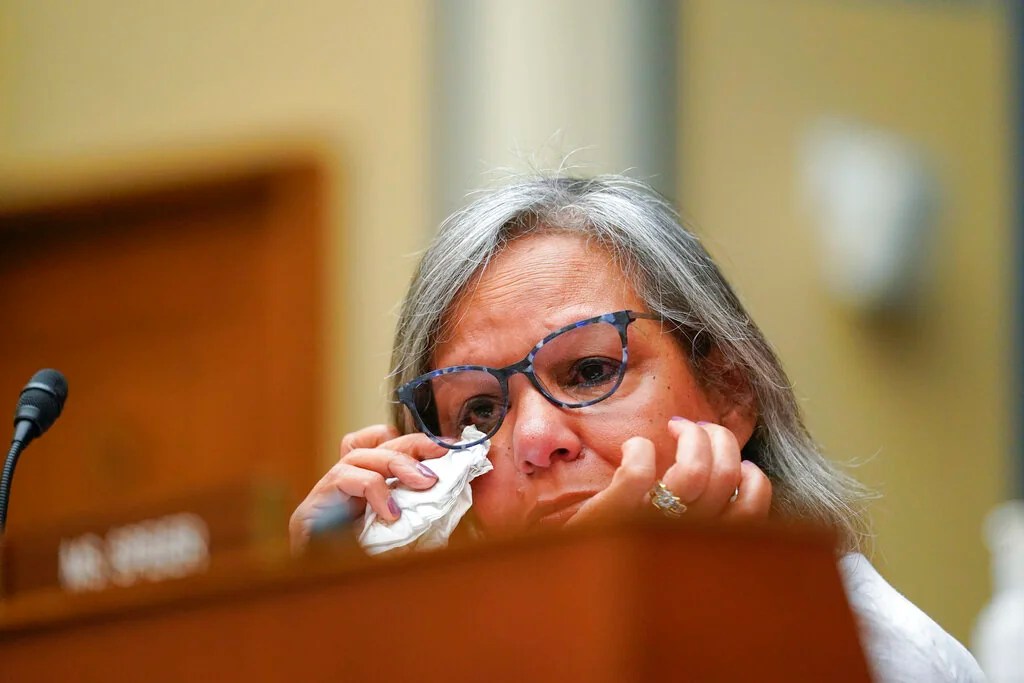 Rep. Robin Kelly, D-Ill., wipes tears from her eye as she listens to testimony during a House Committee on Oversight and Reform hearing on gun violence on Capitol Hill in Washington, Wednesday, June 8, 2022. 