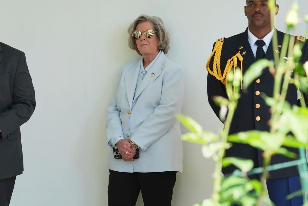 White House Chief of Staff Susie Wiles, center, listens as President Donald Trump speaks during a National Day of Prayer event in the Rose Garden of the White House, Thursday, May 1, 2025, in Washington.